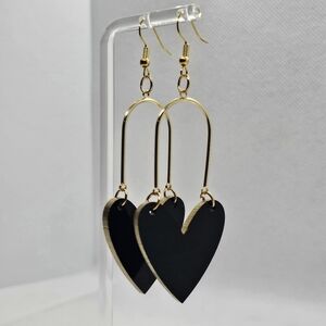 Heart Shaped earrings. Made out of acrylic with gold trimming and gold hardware!